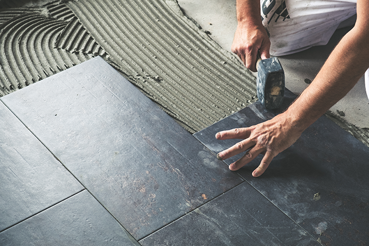 Laying down tiles